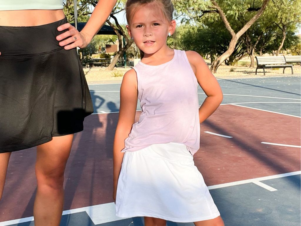 Little girl wearing a tennis skirt
