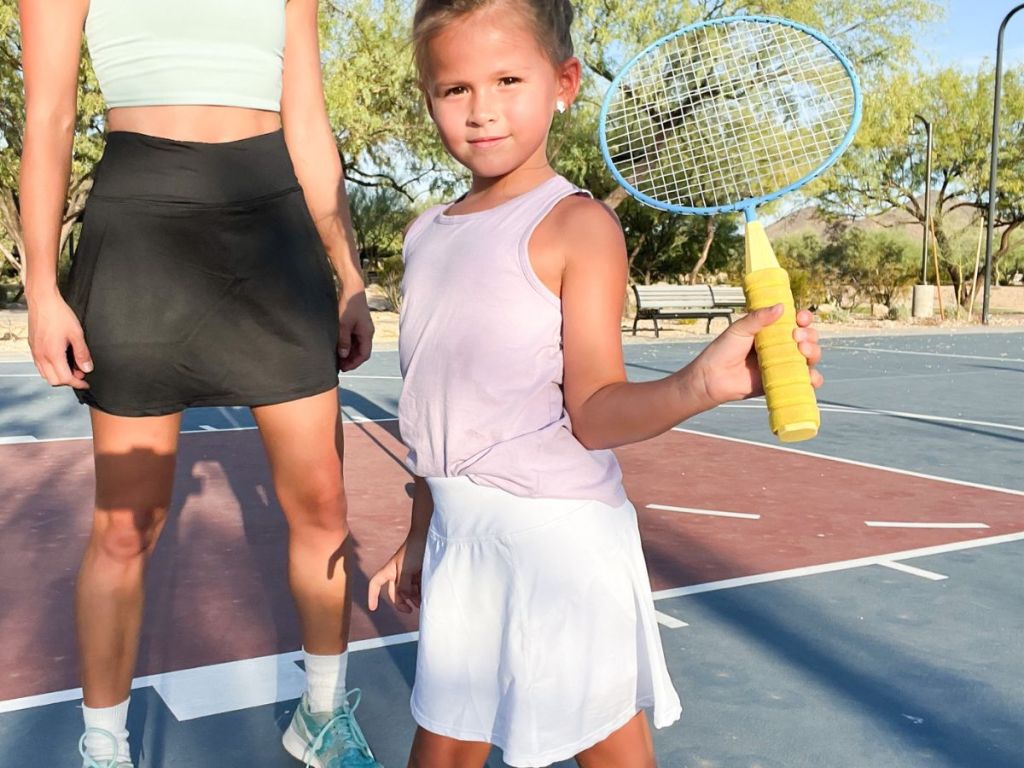 Little girl holding a tennis racquet