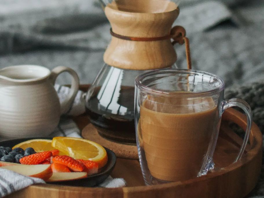 A Tervis insulated mug next to a coffee carafe