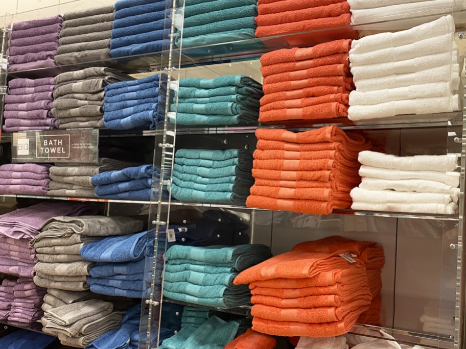 wall display of bath towels in store