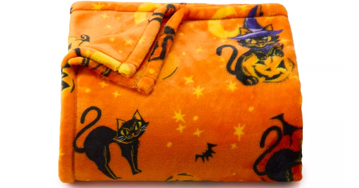 orange throw blanket with black cat print