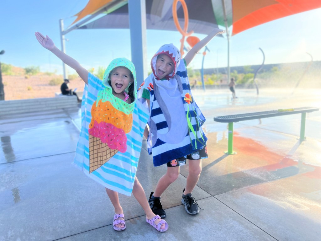 kids posing in The Big One Kids Hooded Towels