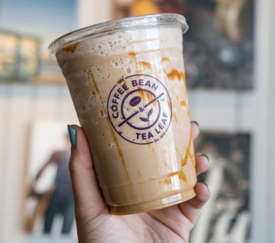 hand holding a The Coffee Bean drink
