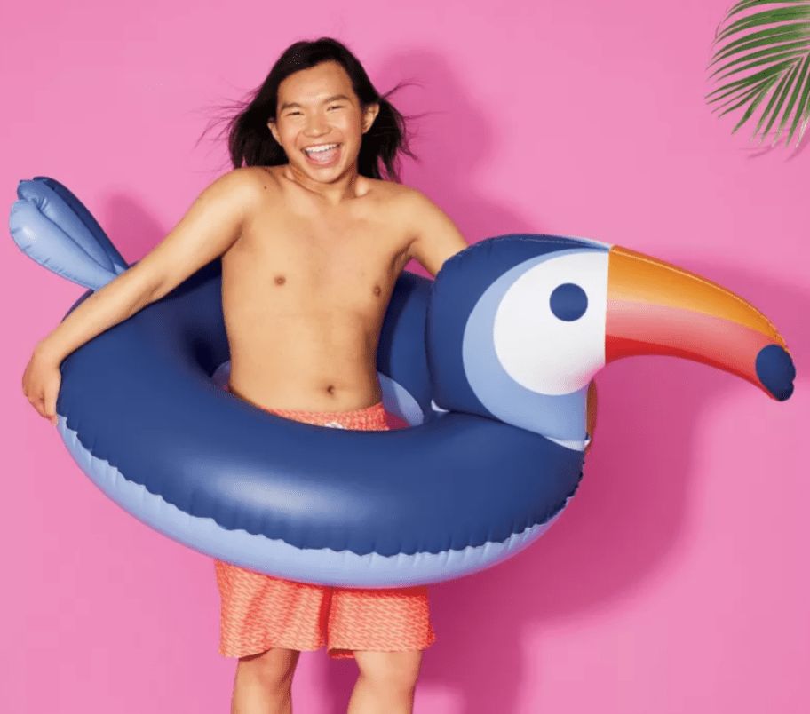 boy using a toucan raft, one of the best pool floats at Target 