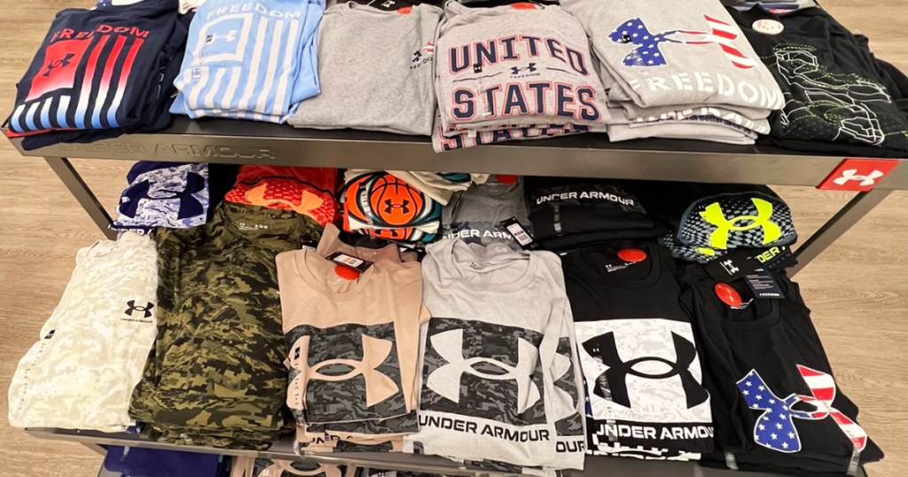store display table full of under armour shirts
