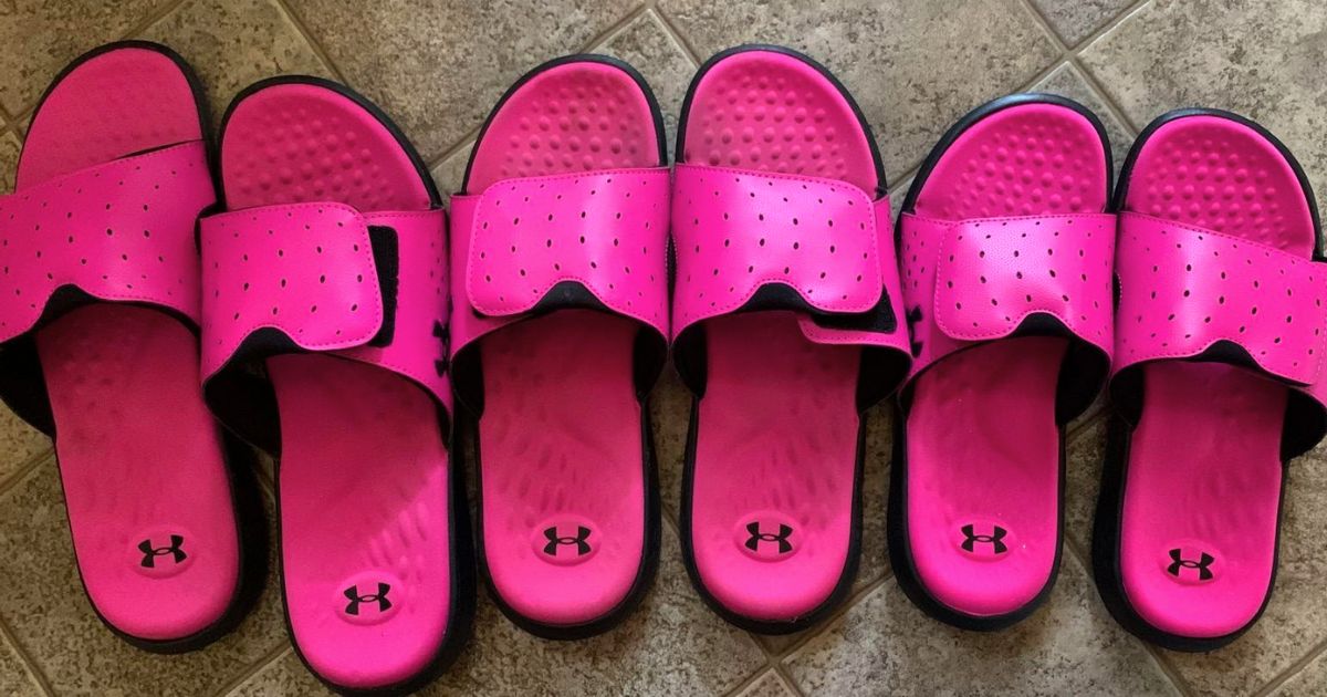 3 pair of Under Armour Women's Ignite Pro Slide Sandal in pink,in different sizes, all lined up