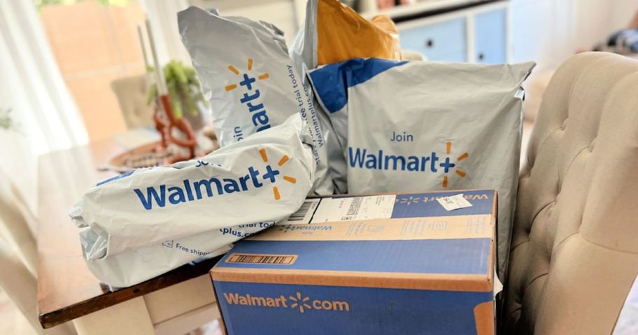 A couch full of packages and a box from Walmart