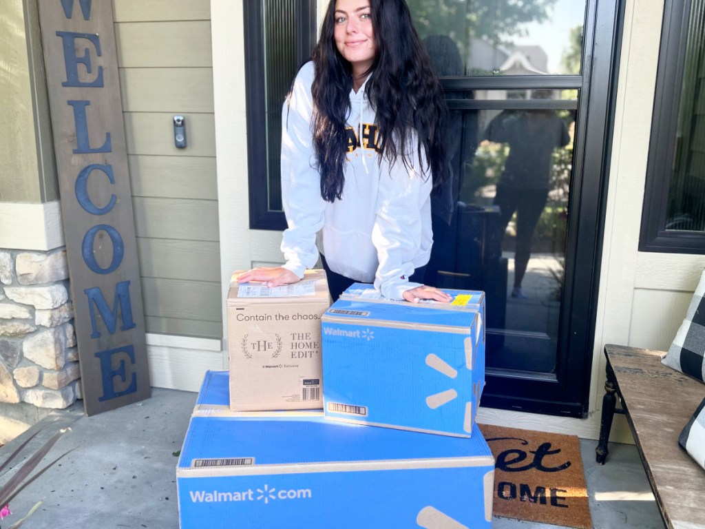 woman outside front door with walmart boxes