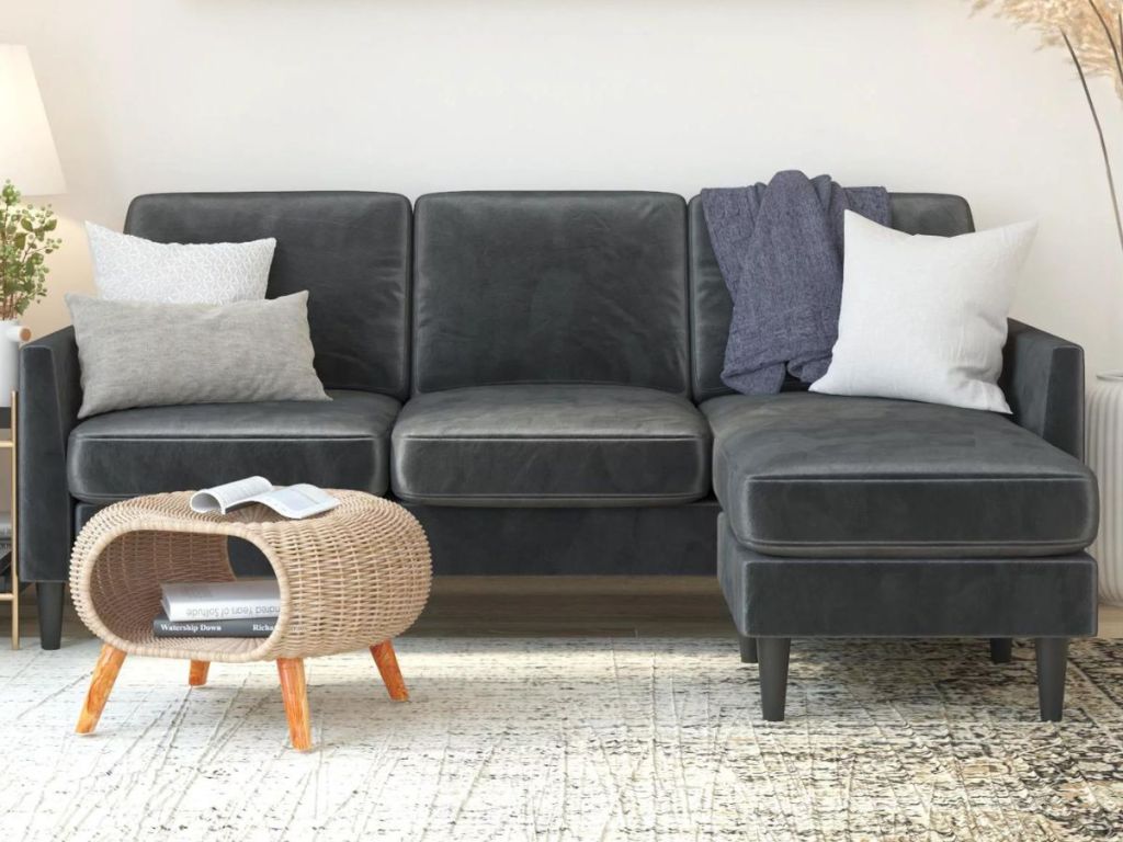 Gray Sectional in living room next to a storage ottoman
