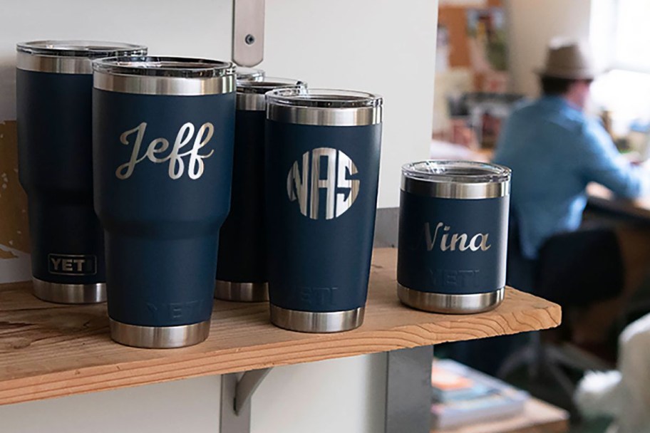 several personalized YETI tumblers on shelf