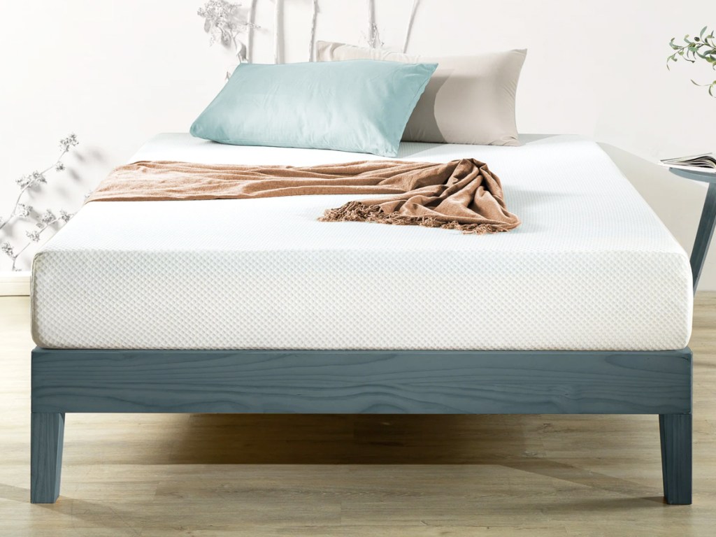 white mattress on a blue foundation