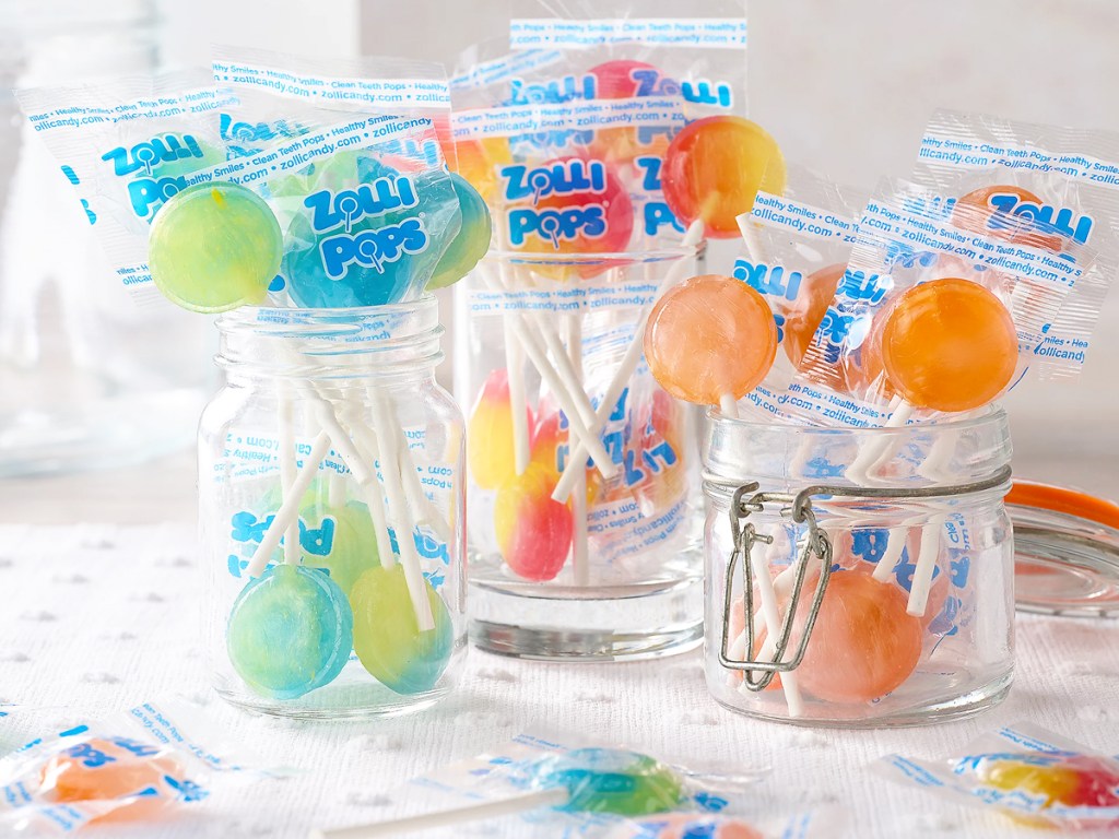 colorful lollipops in glass jars