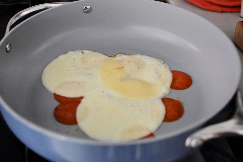 adding cheese to skillet