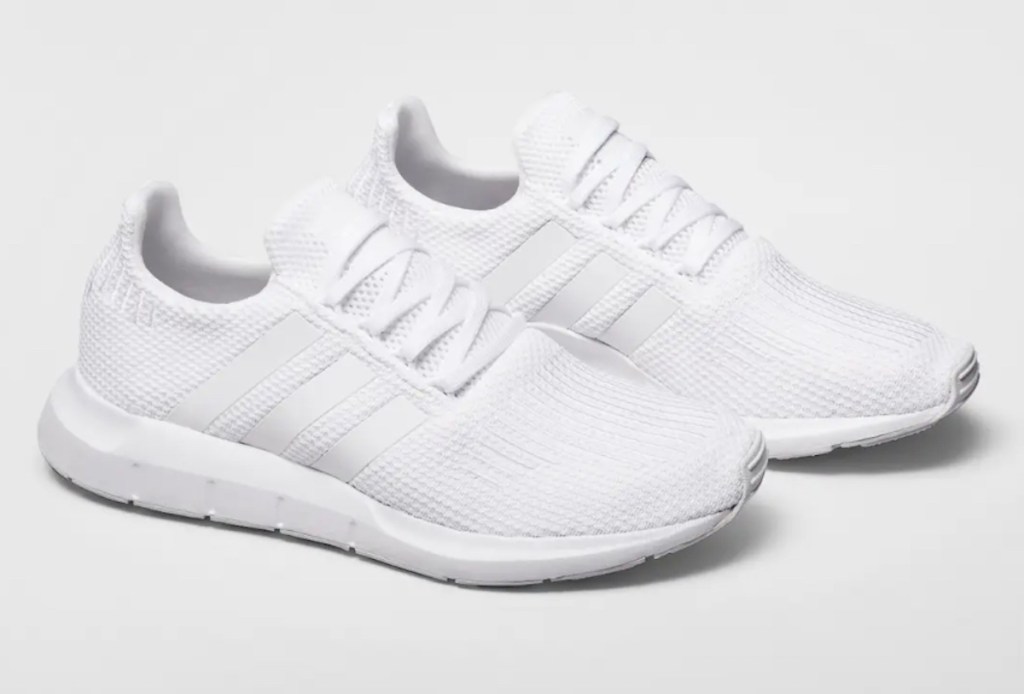 white adidas running shoes on light gray background