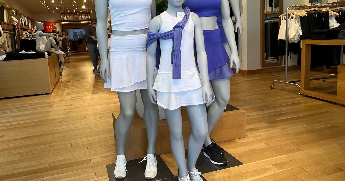 mannequins wearing white and purple skorts and tanks