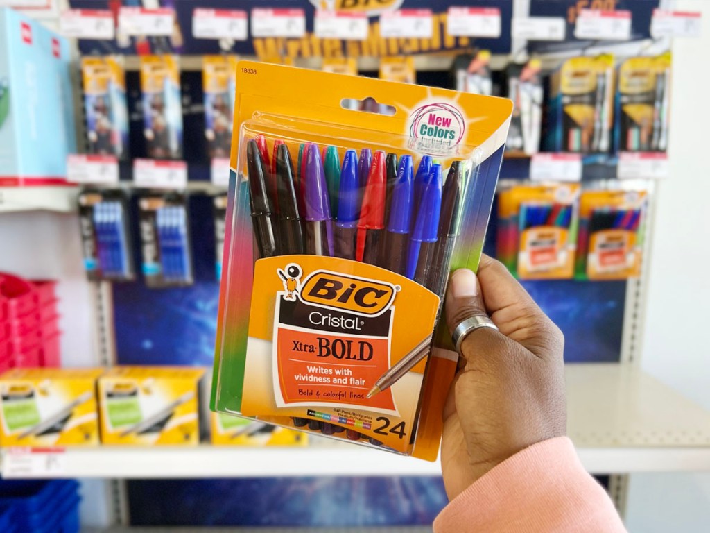 hand holding bic xtra bold pens pack