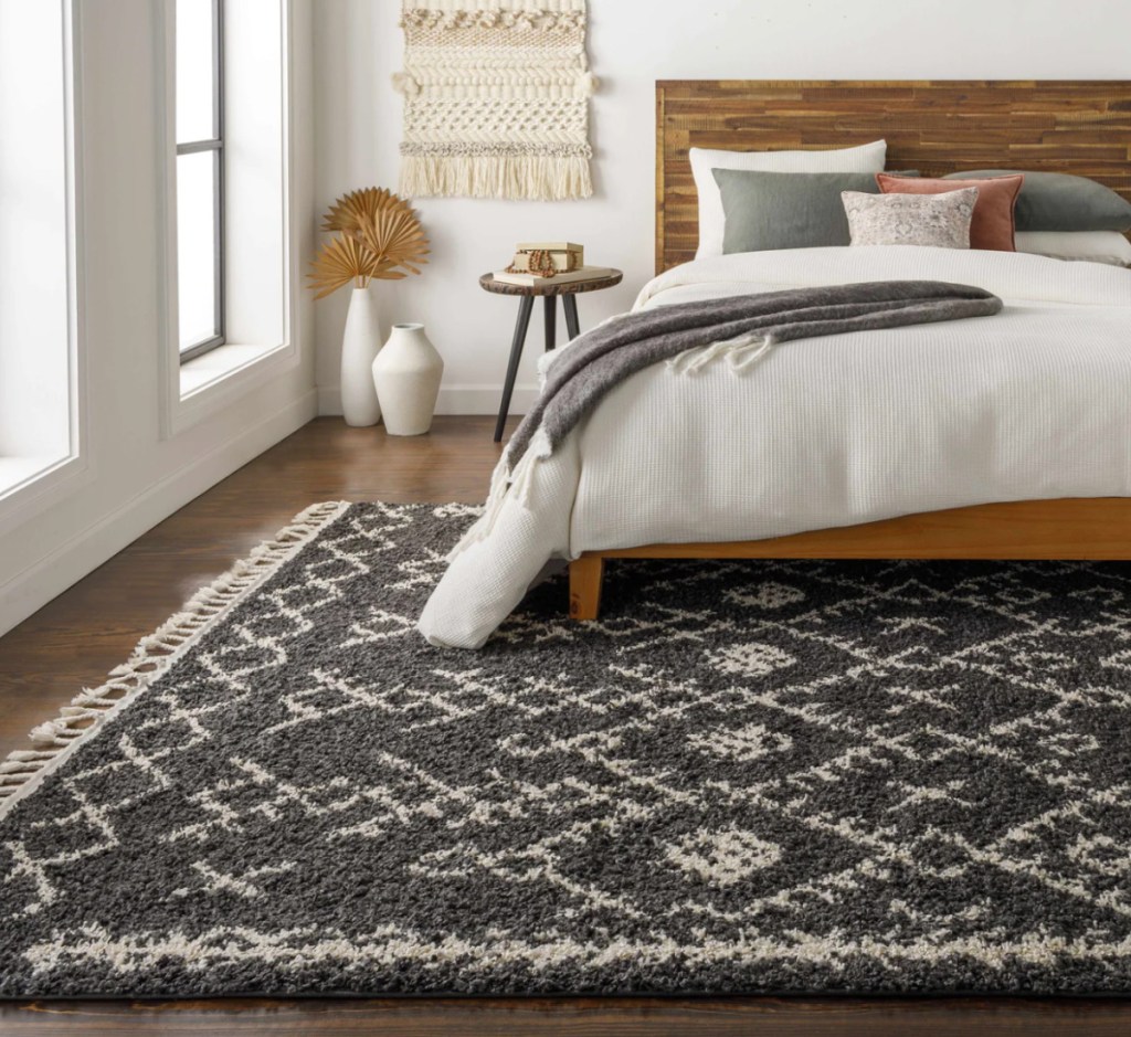 black plush area rug in boho bedroom