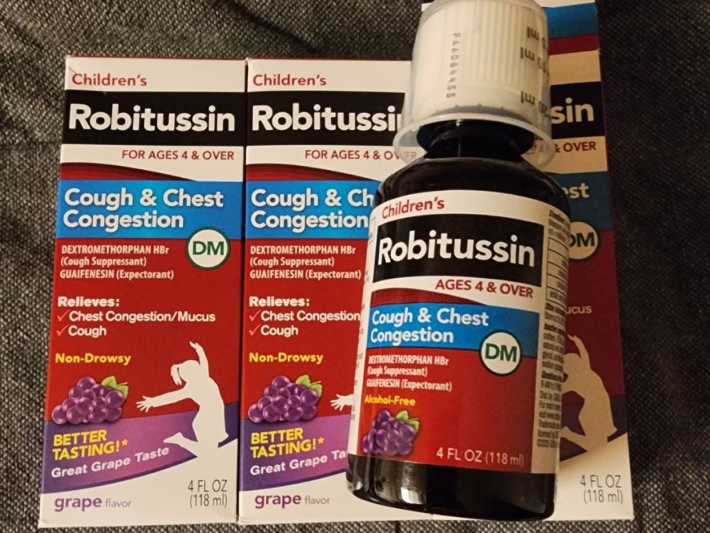 boxes of robitussin opened showing the bottle