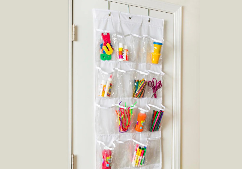 white 24 pocket shoe rack with craft supplies on door