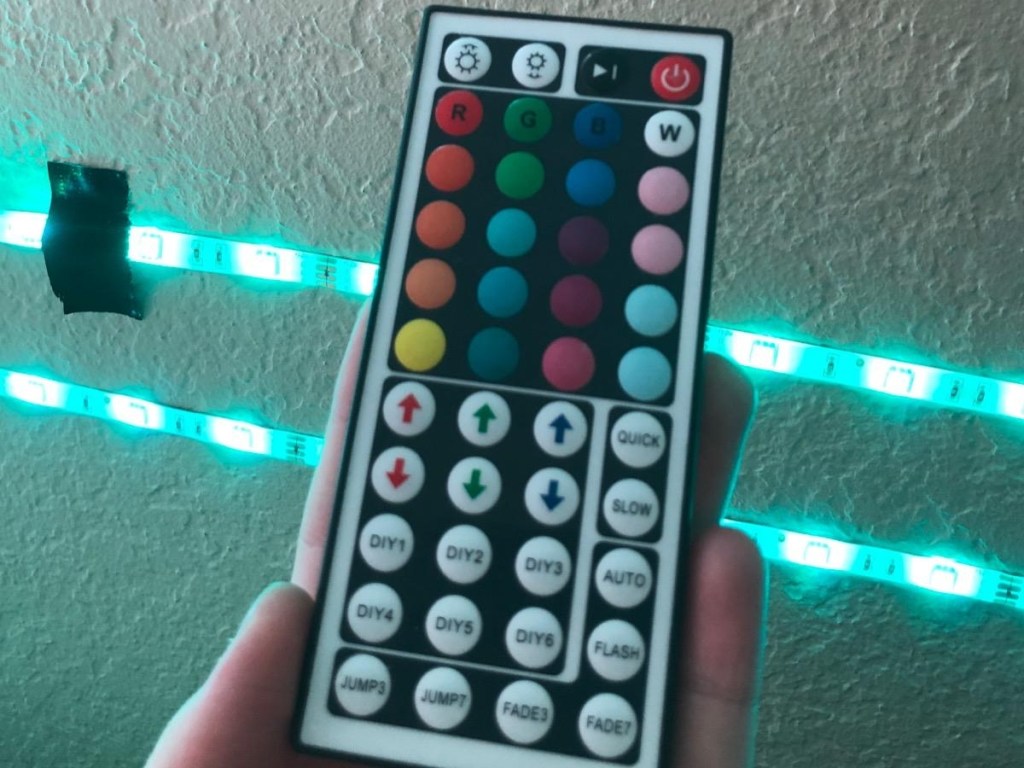 holding remote used to operate LED lights