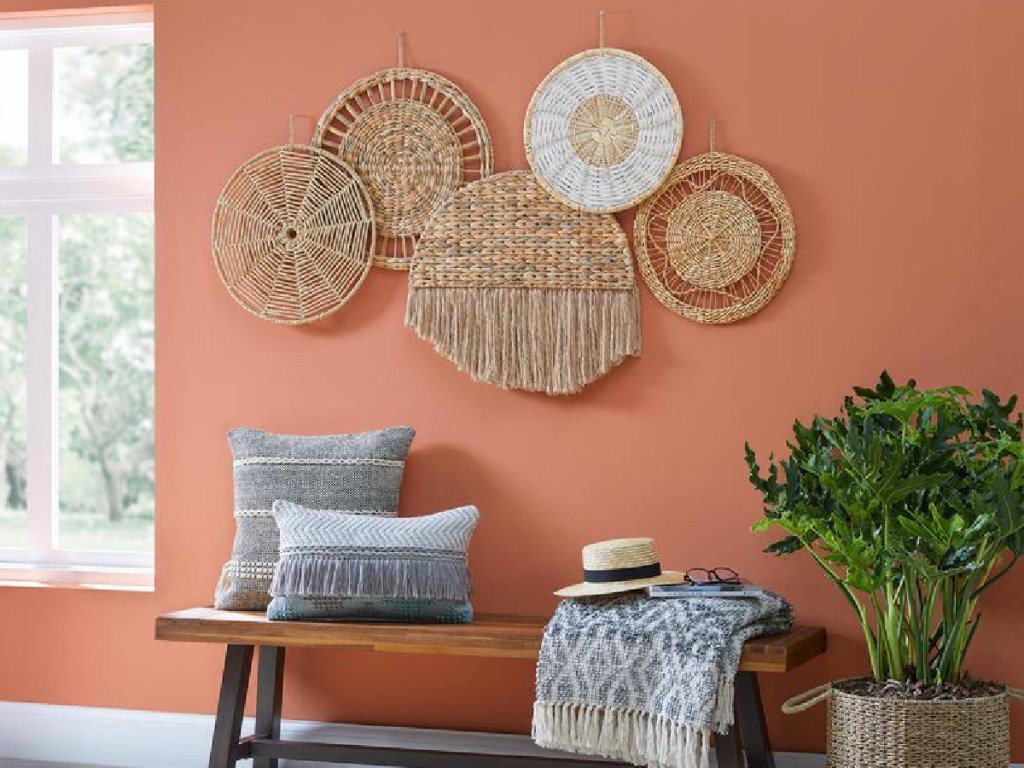 display of woven art on the ways in a dining room