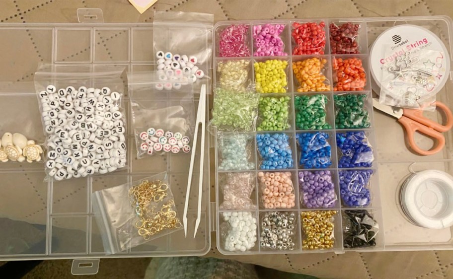 bead making kit pieces in plastic storage conatiner on table
