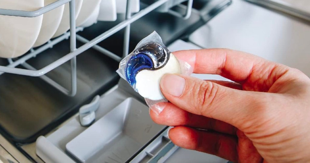 hand holding dishwasher pod