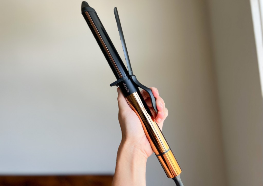 hand holding up curling iron