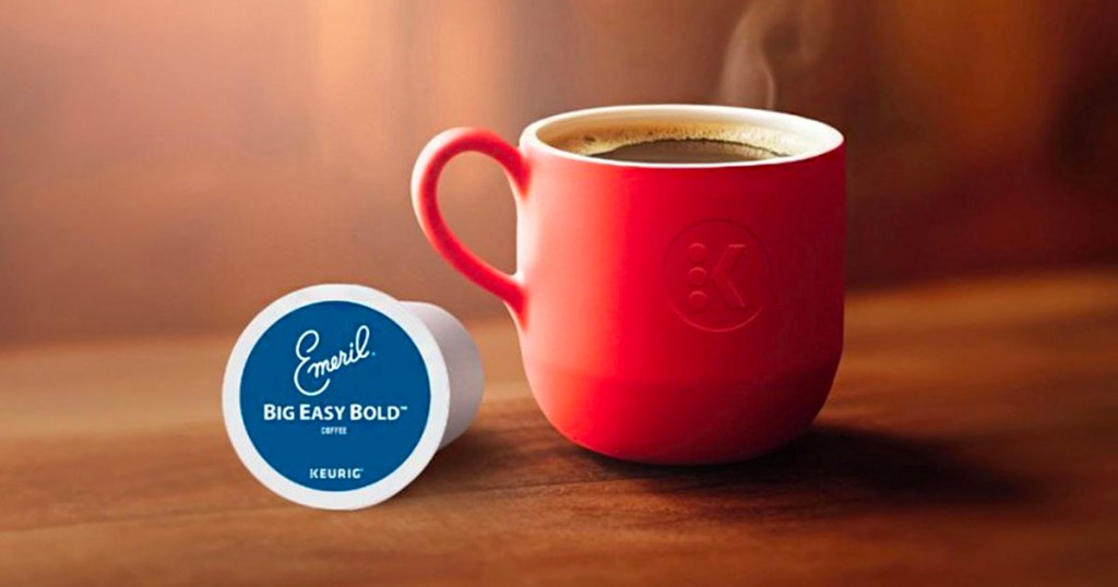 emeril k cup next to red coffee mug