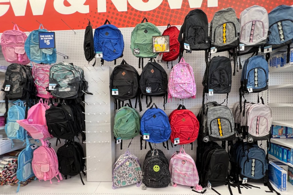 several backpacks against wall in store
