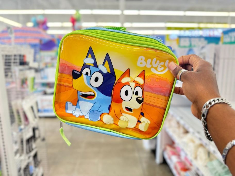 Bluey Lunch Bag being held by hand in store