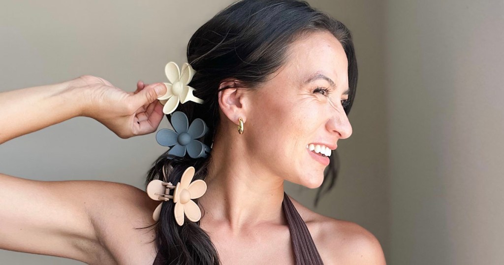 woman with three flower hair clips in hair