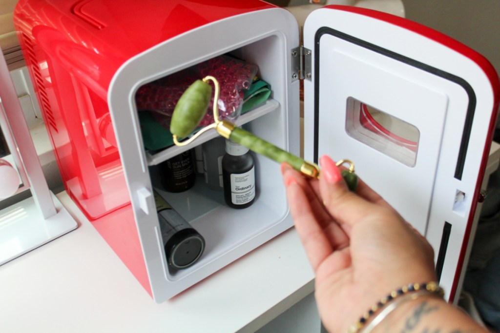 putting beauty roller into red mini fridge