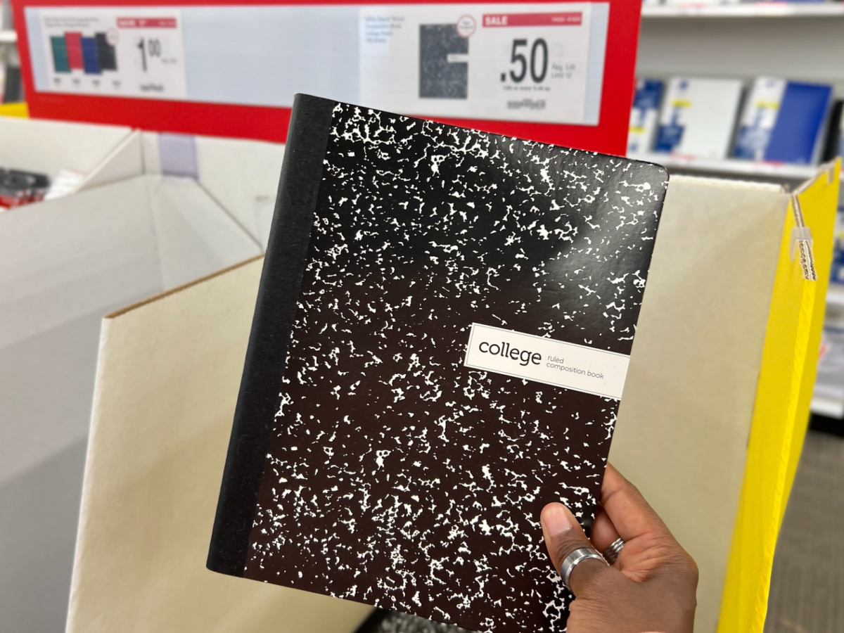 hand holding Office Depot Brand Composition Notebook on display