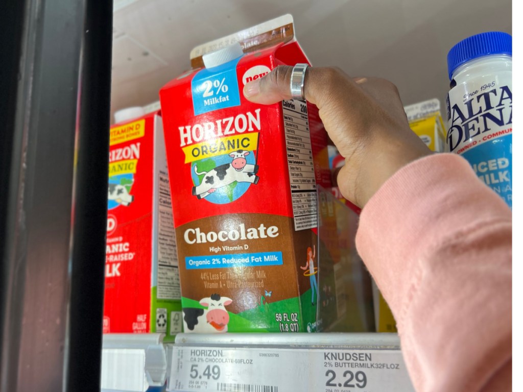 hand pulling Horizon Chocolate Milk 59oz from the fridge