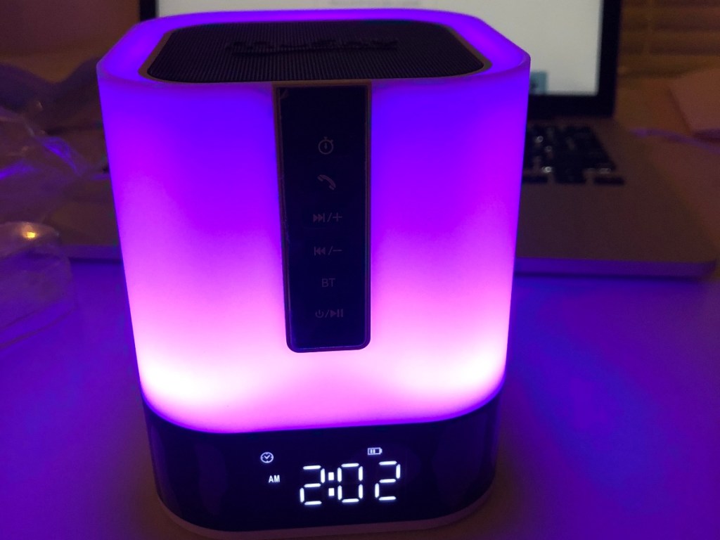 bedside speaker glowing purple