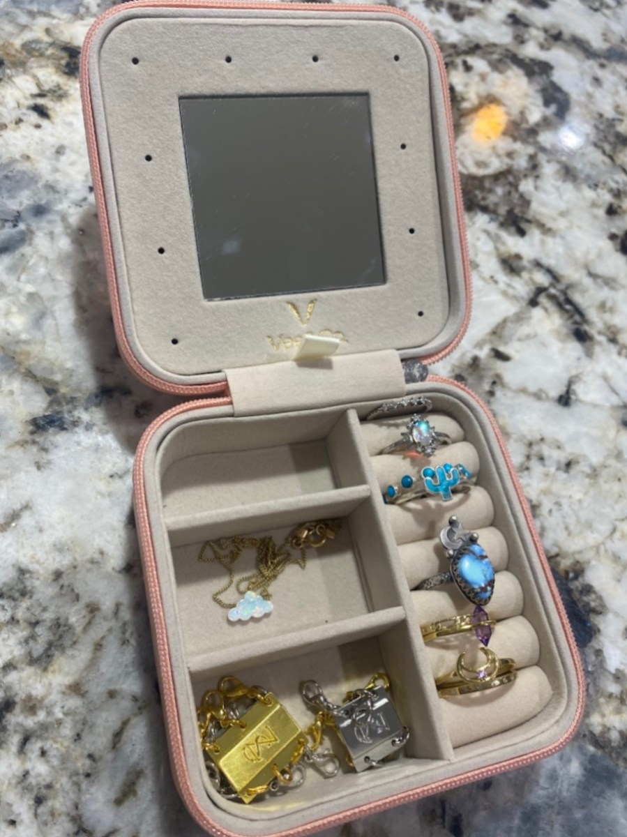 open jewelry case on granite countertop