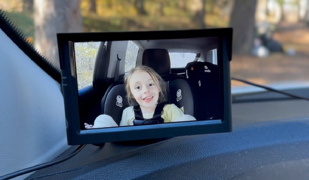 view of child in backseat on mini screen
