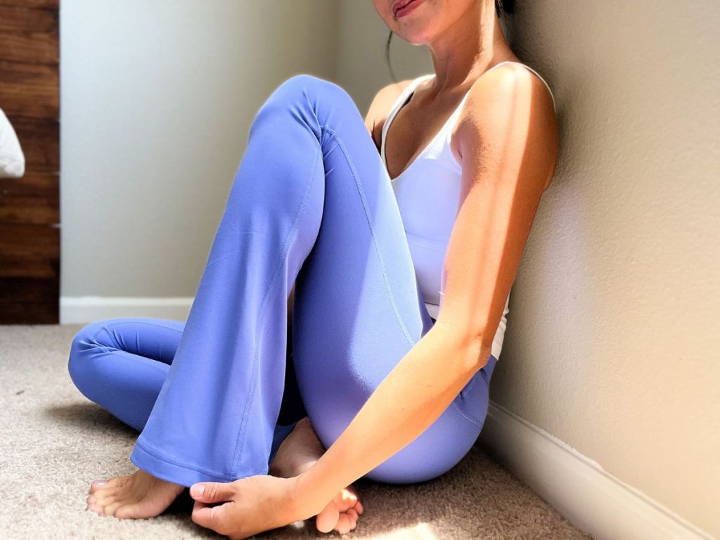 woman sitting on floor wearing lululemon leggings