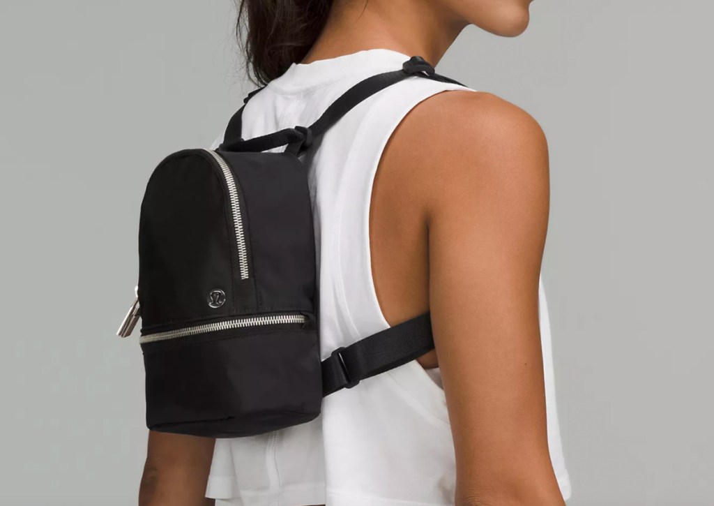 micro black backpack on back