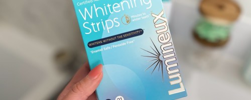 hand holding box of whitening strips