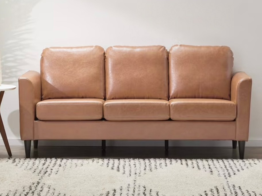 brown leather sofa in living room 