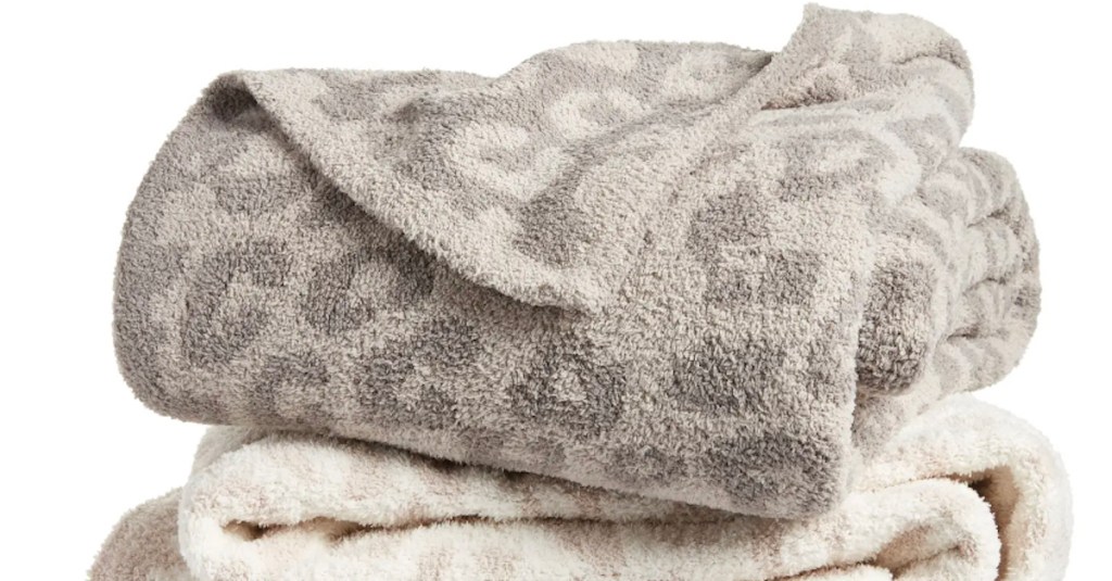 stock photo of gray and cream leopard throw blanket