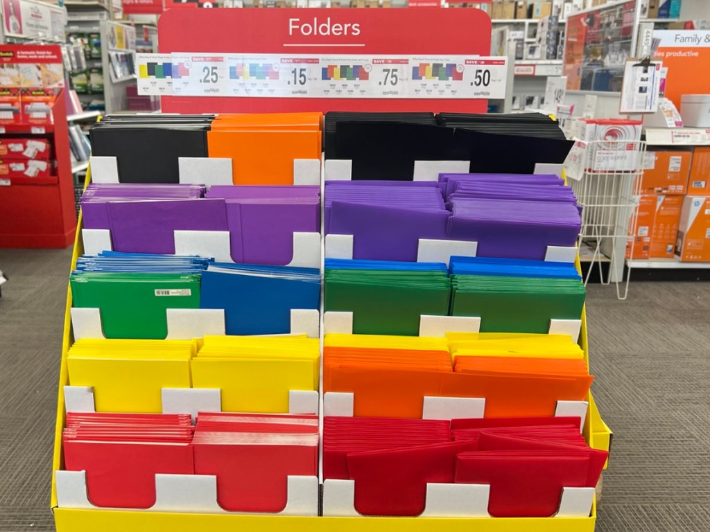 multi colored folders on stand in office depot