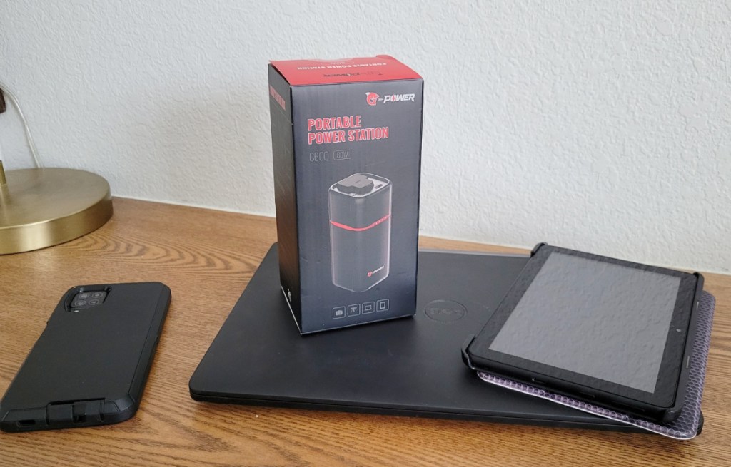 portable power bank with phone and laptops around