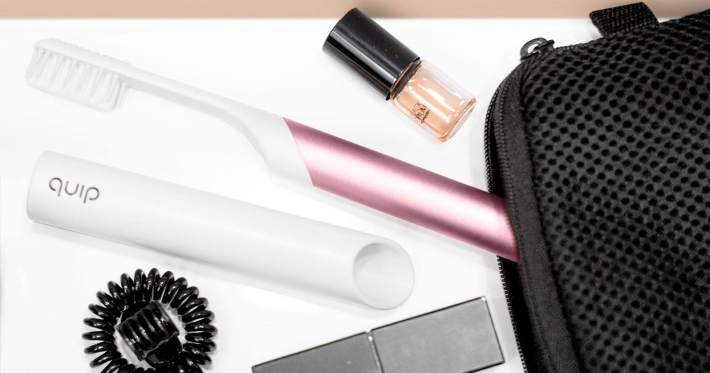 pink and white toothbrush in travel bag