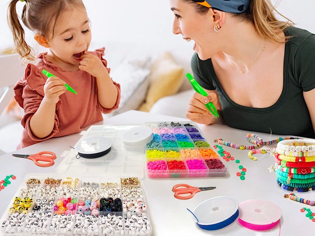 woman and child making bracelets with bead kit