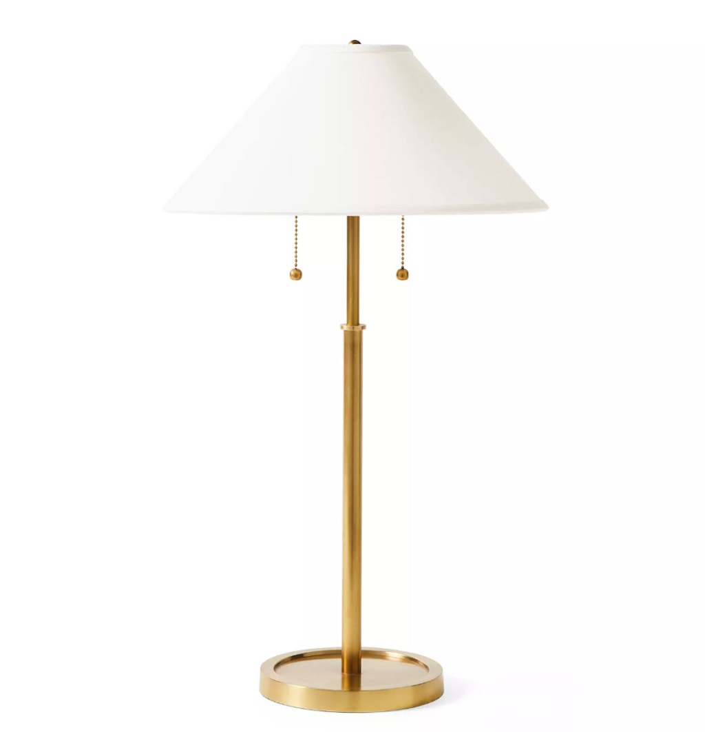 white and gold vintage lamp on white background