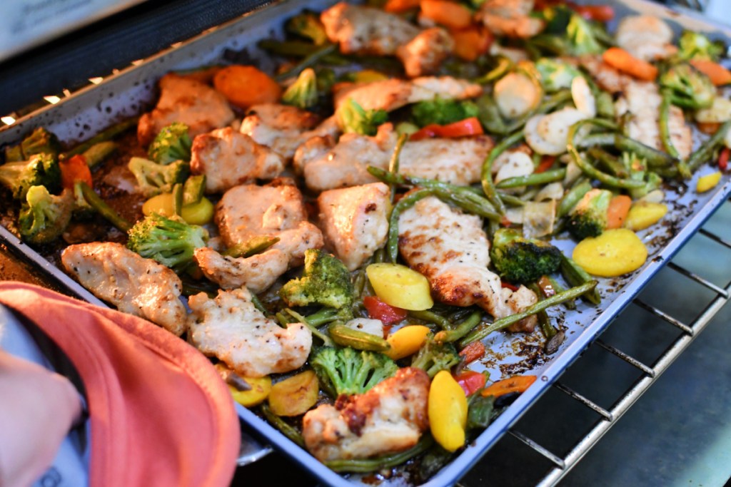 sheet pan in the oven with veggies