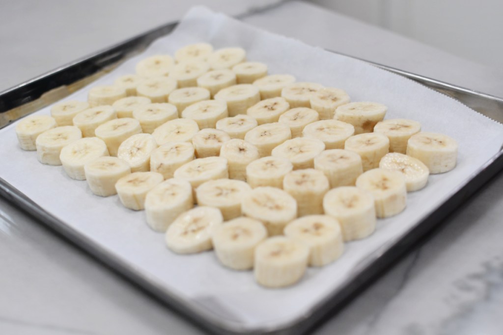 sliced bananas on a sheet pan